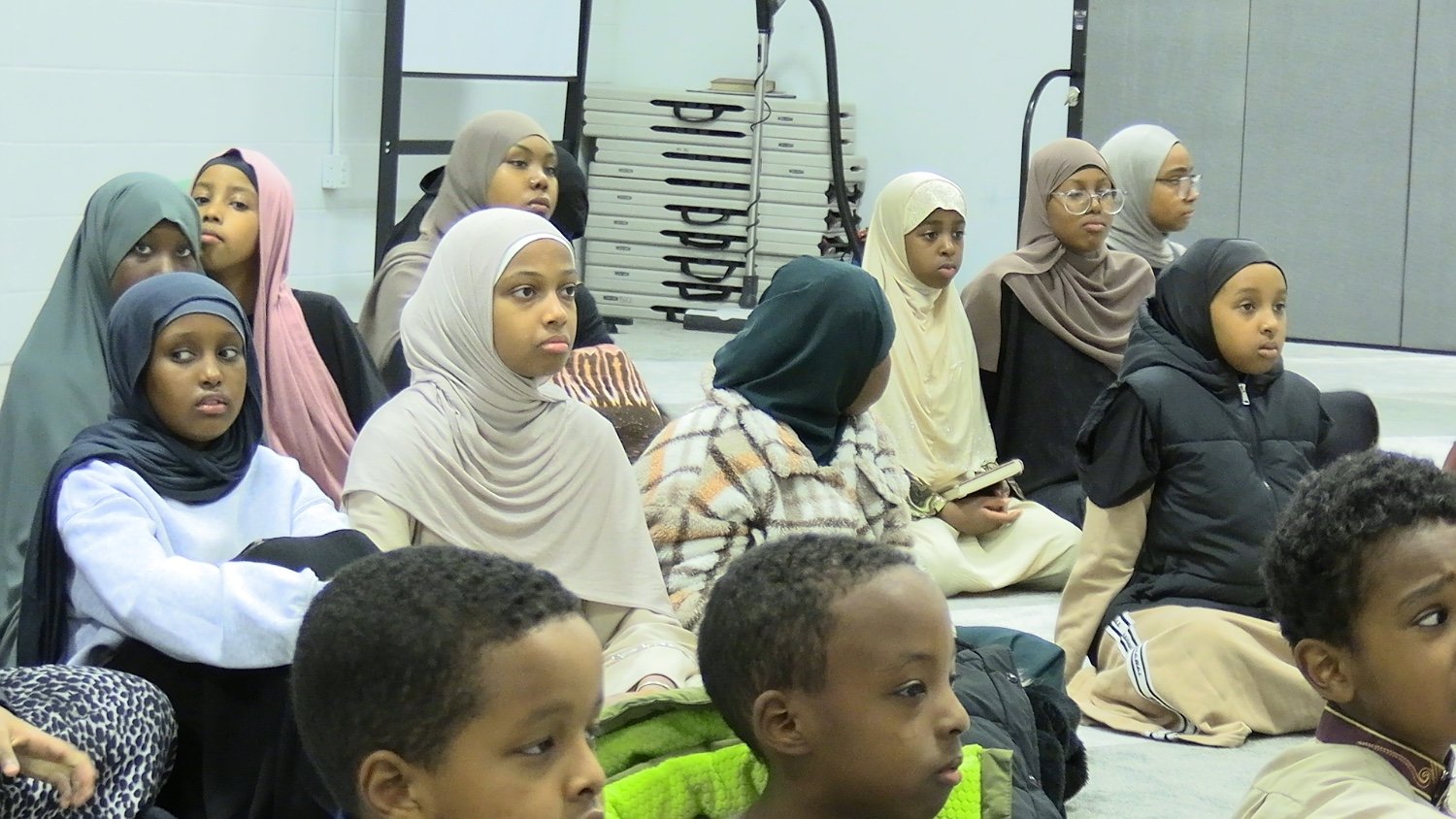 Community youth gathered at a Sahaba event