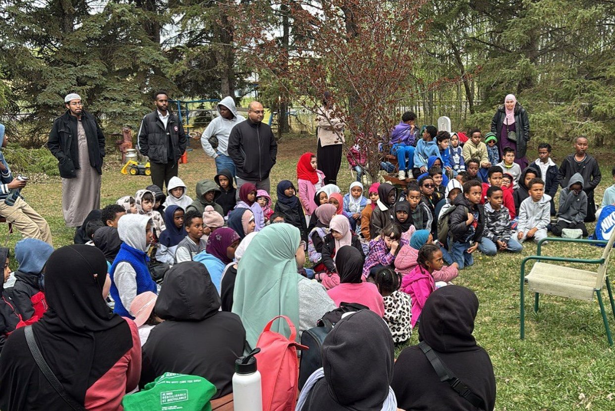 Youth gathered outdoors for a leadership program