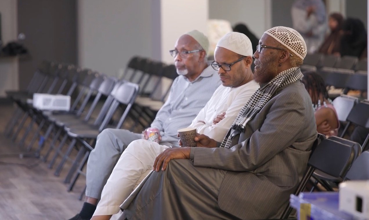 Community members in a calm, supportive setting